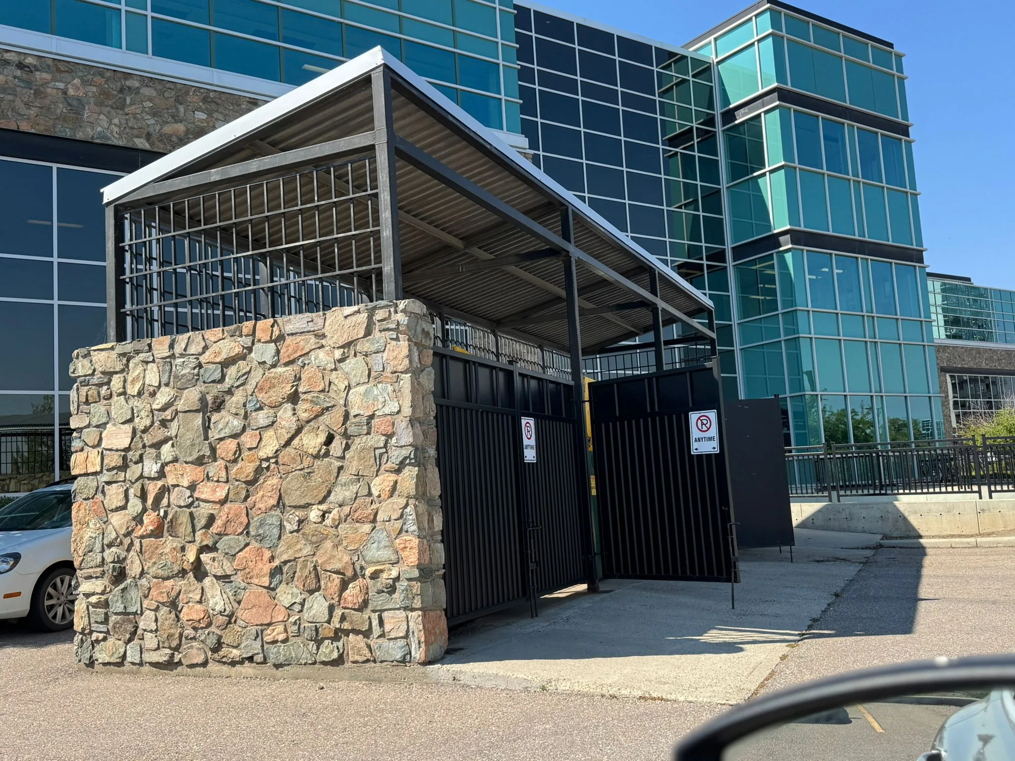 Garbage enclosure, stone-clad steel